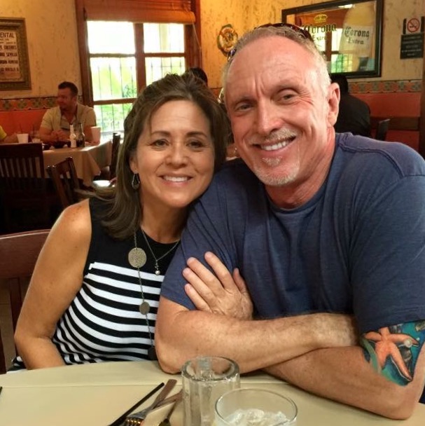 Johnny and Vera smiling together at a restaurant—before their Alzheimer's journey intensified