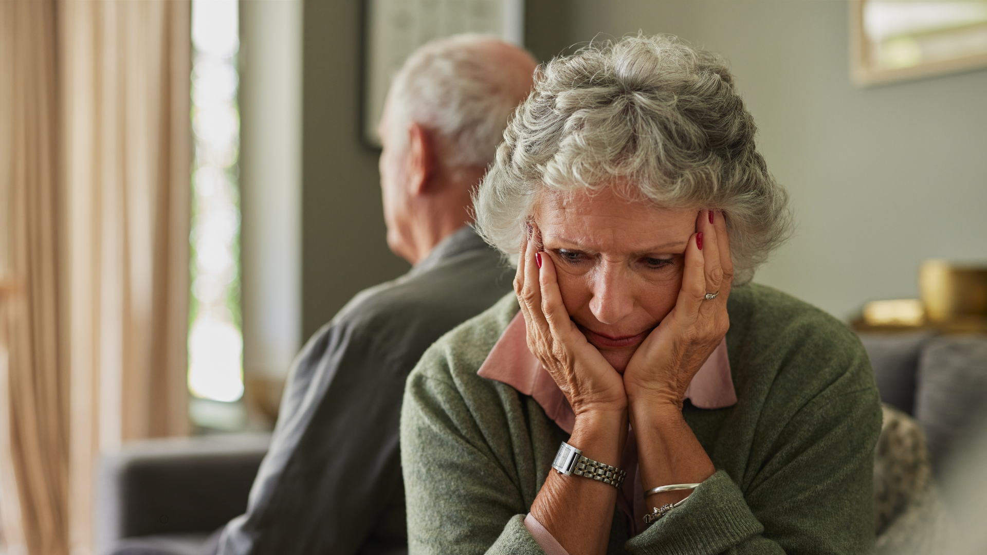 Woman with back to her spouse, representing caregiver exhaustion and burnout